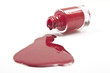 Photo: red nail polish splashed on white background red nail polish splashed on white background