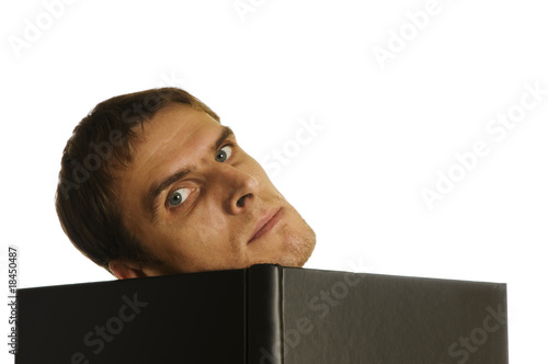 Foto: man behind the open book on white background man behind the open book on white background