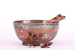 star anise,cinnamon stick and a bowl