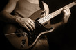 man playing electrical guitar