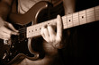 man playing electrical guitar