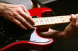 man playing electrical guitar