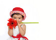 Baby holding a flower