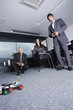 Photo: People playing with mini automobiles People playing with mini automobiles