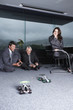 Photo: Businessmen playing with toy automobiles Businessmen playing with toy automobiles