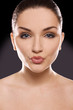 Beautiful woman blowing kiss
