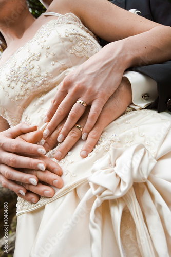 Photo: newlyweds tenderly holding hands newlyweds tenderly holding hands