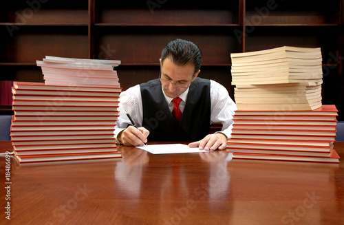 Photo: lawyer is signing the contract lawyer is signing the contract