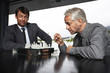 Businessmen playing chess