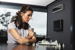 Businesswoman playing chess