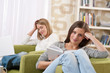 Students - Two female teenager studying in modern living room