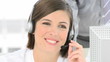 Businesswoman talking on a headset in the office
