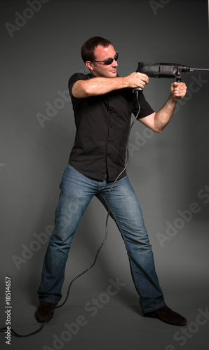 Photo: man drilling man drilling