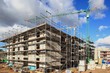 Baukrane, Krane, Hochbau, Hausbau, Wolkenhimmel