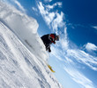 skier rush in clouds of snow powder