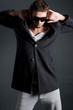 Photo: male model posing in trendy clothes male model posing in trendy clothes