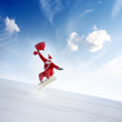 Junger Weihnachtsmann beim Extremsport
