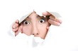 Photo: young girl peeping through hole in white paper young girl peeping through hole in white paper