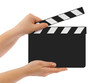Blank clapboard in hands
