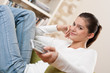 Students - Smiling female teenager watching television