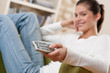 Students - Smiling female teenager watching television