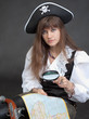 Woman - sea pirate with a map and magnifier Woman - sea pirate with a map and magnifier