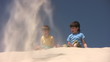 Boys plays with the sand