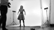 Photographer and model in studio. In black and white colour Photographer and model in studio. In black and white colour