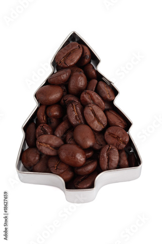 Photo: Beans of coffee in the form of Fir Tree close up Beans of coffee in the form of Fir Tree close up