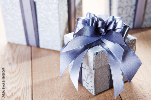 Photo: blue gift box with a red tape blue gift box with a red tape