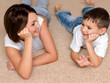 Mother and son look against each other