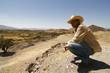 Handsome man with a hat, watching over the land