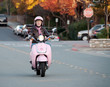 lady biker on pink scooter