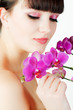 happy young woman with orchid on white background happy young woman with orchid on white background