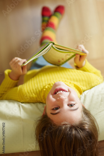 Photo: girl reading book girl reading book