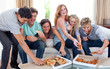 Photo: Friends eating pizza at home Friends eating pizza at home