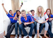 Photo: Teenagers watching a football match at home Teenagers watching a football match at home
