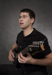 Man sitting and playing electric guitar