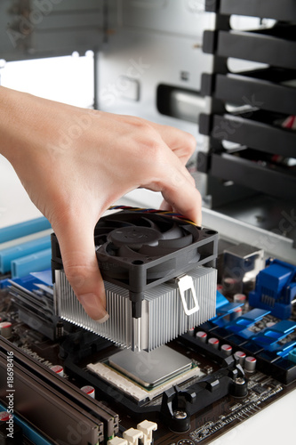 Photo: Mounting Cooling Fan on CPU Mounting Cooling Fan on CPU