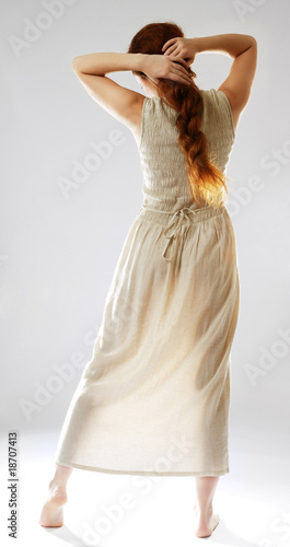 Photo: Girl barefooted in sundress. Girl barefooted in sundress.