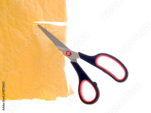 Scissors cutting paper © AGITA LEIMANE #18710607. Scissors cutting paper