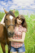 Brunette girl with horse
