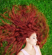 Young girl lying on grass