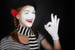 Portrait of a happy mime comedian showing OK Portrait of a happy mime comedian showing OK