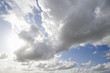 Sun shining in blue sky with clouds