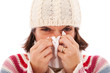woman sneezing to a tissue woman sneezing to a tissue
