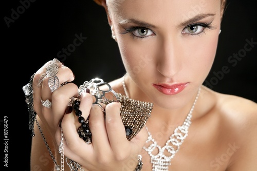 Photo: Ambition and greed in fashion woman with jewelry Ambition and greed in fashion woman with jewelry