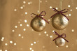 Three gold Christmas balls