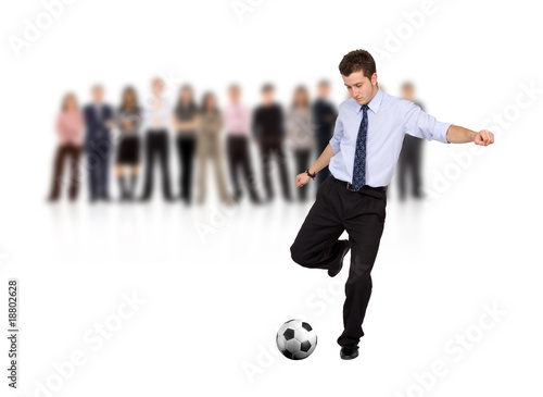 Photo: business man with a football business man with a football