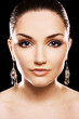 Beautiful woman earing diamond earrings